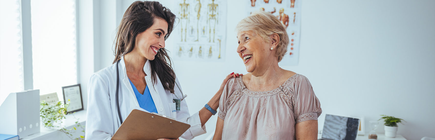 A female doctor and female patient discussing pain management.