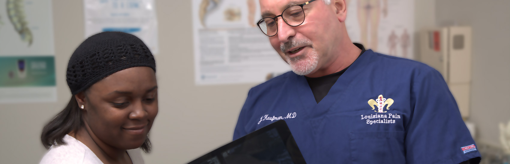Dr. Kaufman showing patient her x-rays.