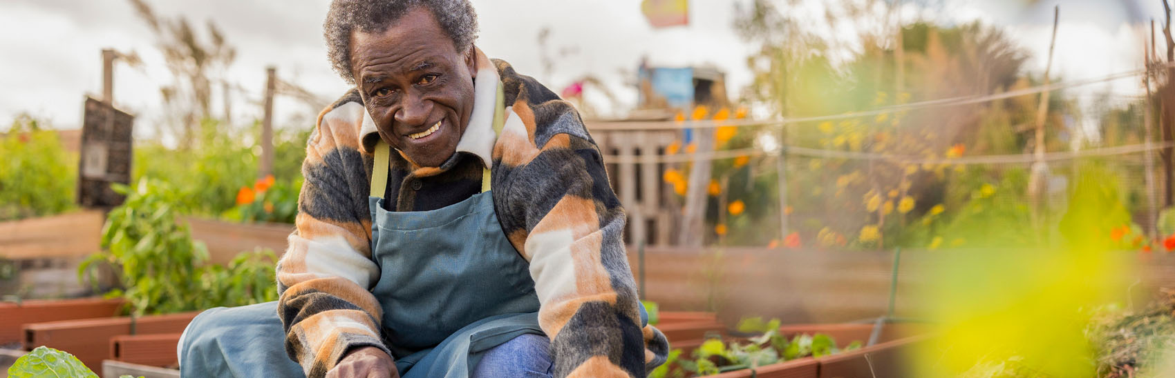 Grandfather gardening with limited pain.