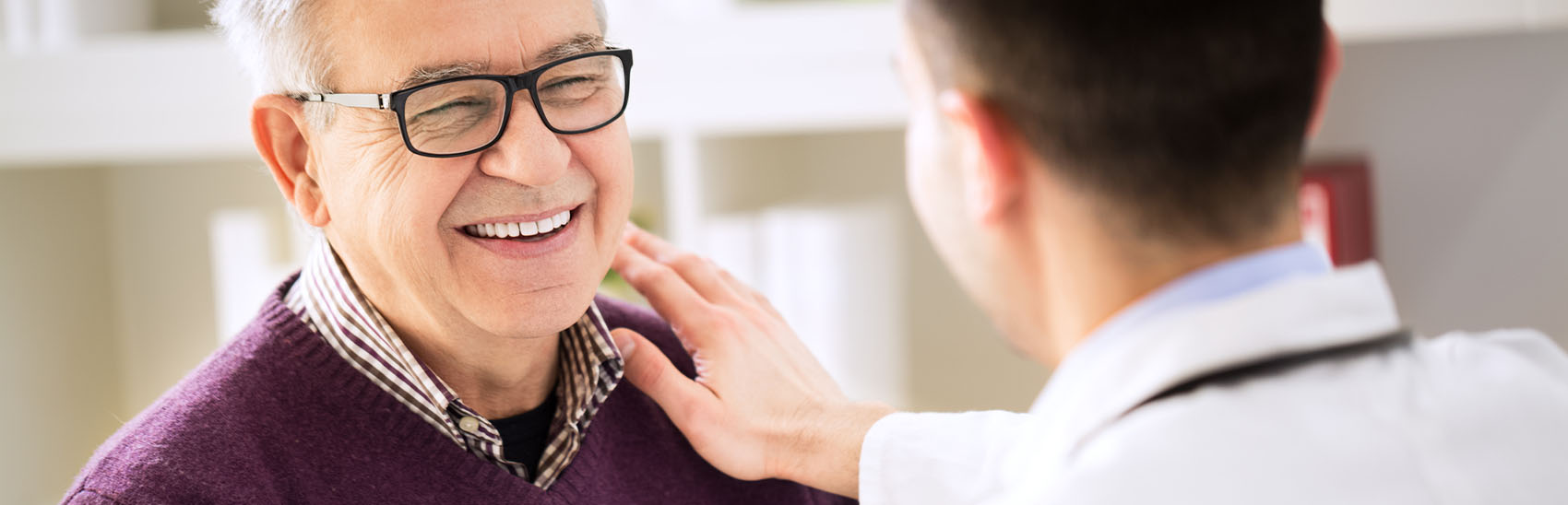A patient relieved from pain with his pain management doctor.