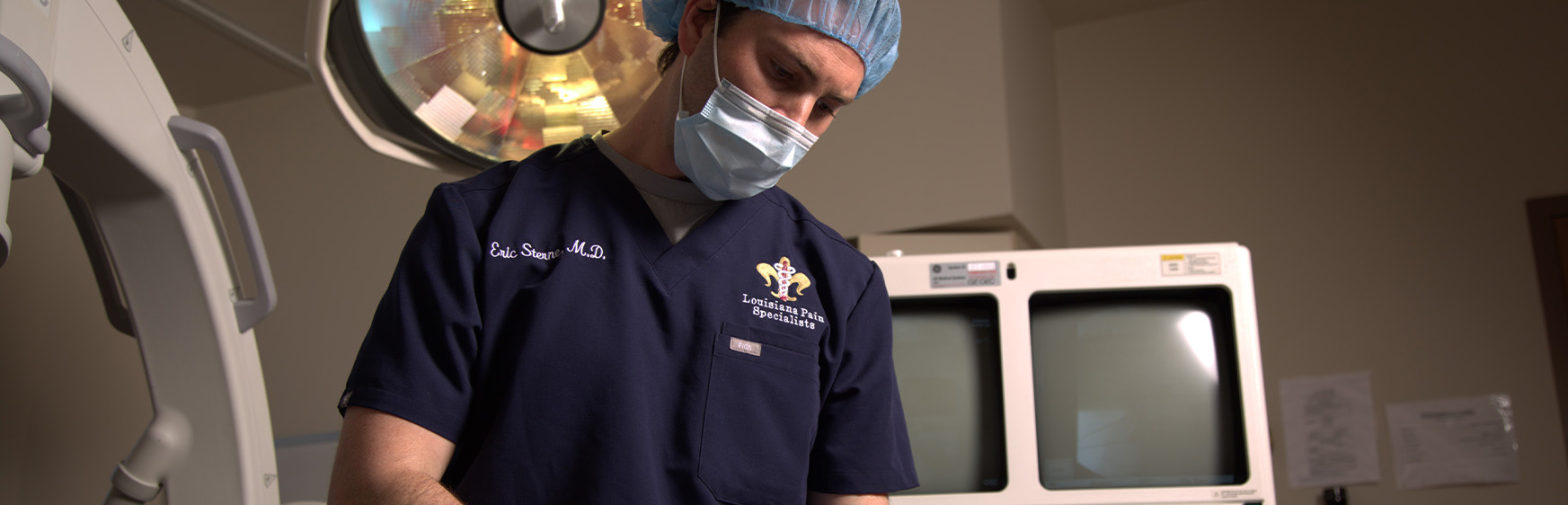 Dr. Sterne, a pain management surgeon, performing surgery.