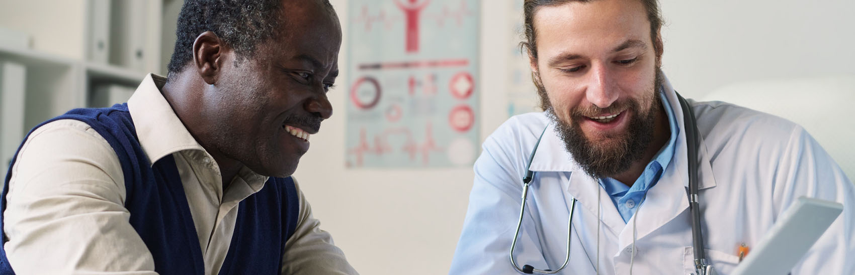 A pain management doctor explaining a patient's pain to him.