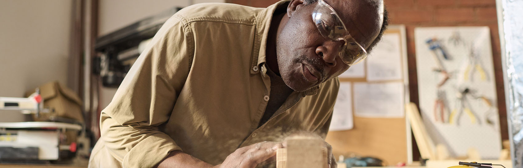 Senior man woodworking pain-free